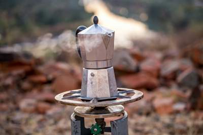 kettle boiling on an outdoor stove