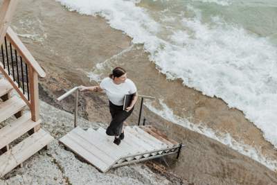 woman climbing a set of stairs